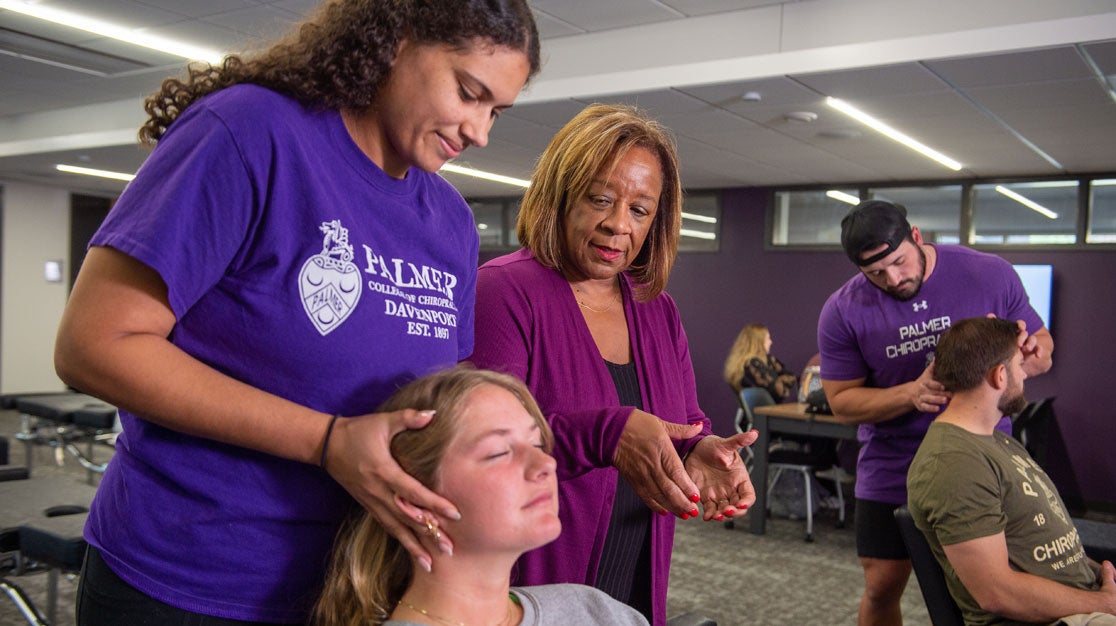 Dr. Payton overseeing student and client.